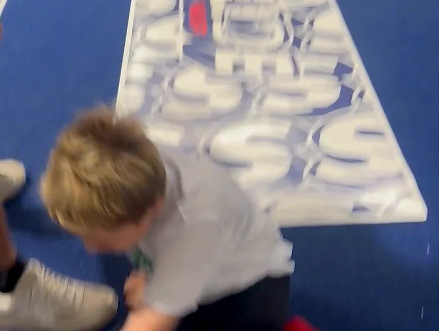 Sliding camp participant